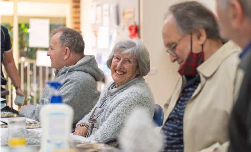 Elderly group socialising together