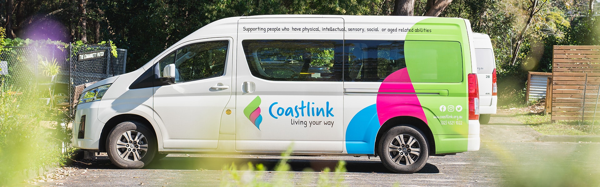 Coastlink transport minibus assisting with transport