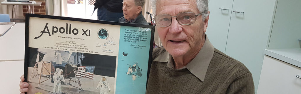 John Watts showing his Man on the Moon photo