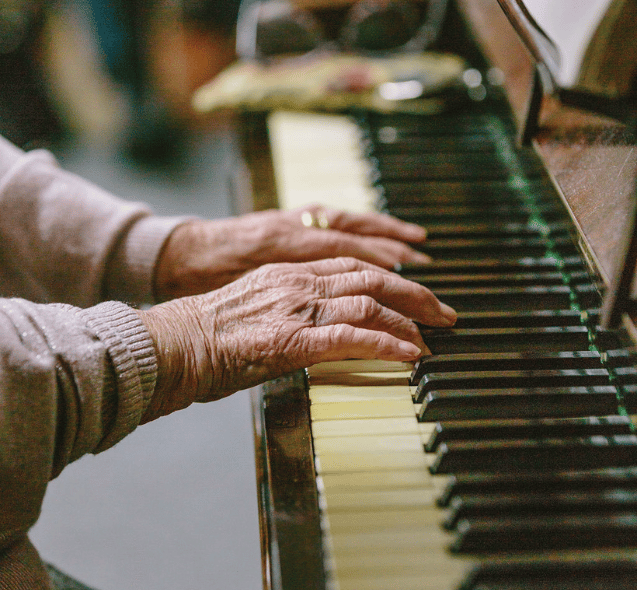 A close-up of hands playing the piano